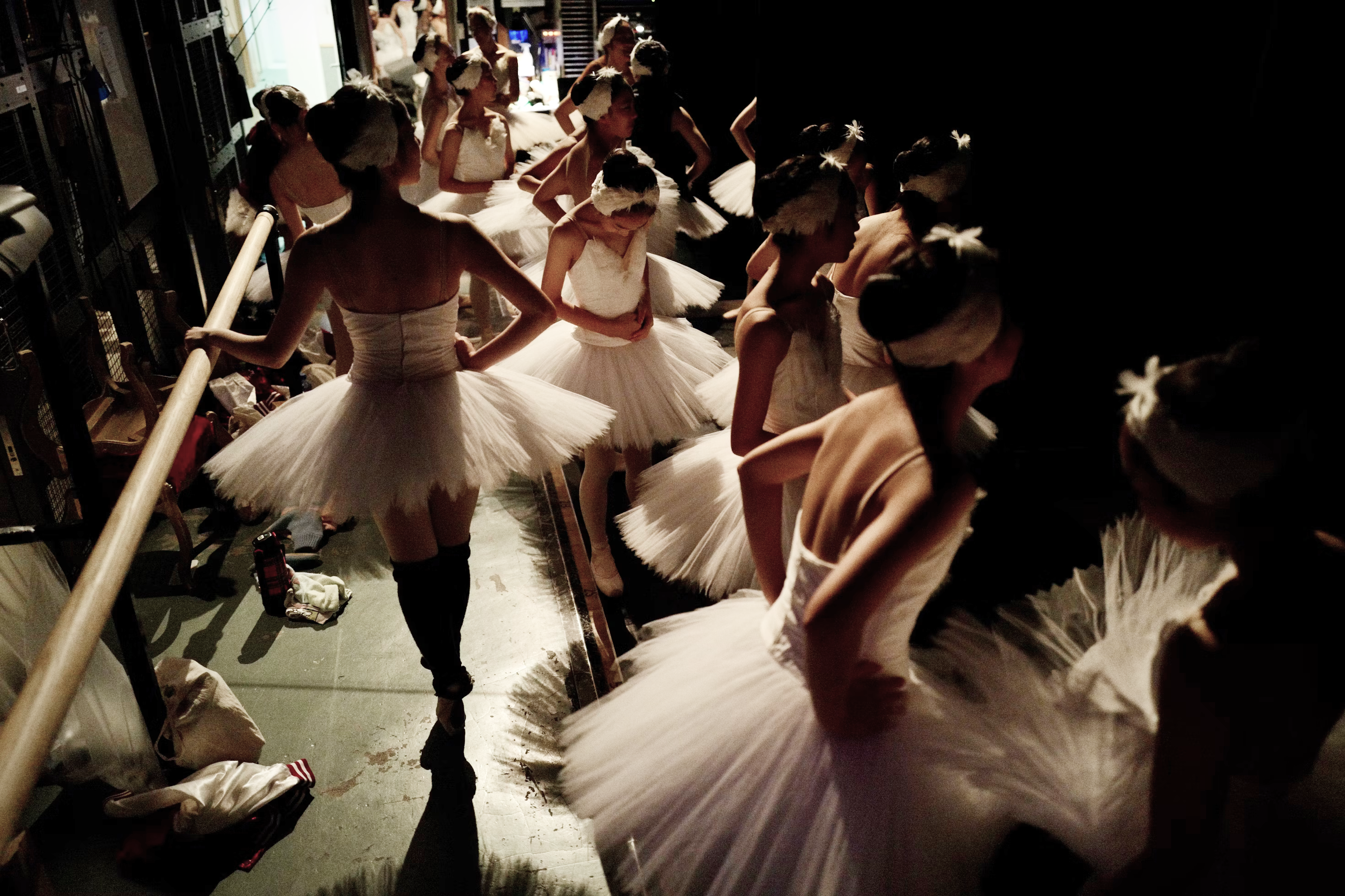 Above shot of ballet dancers getting ready to rehearse 
