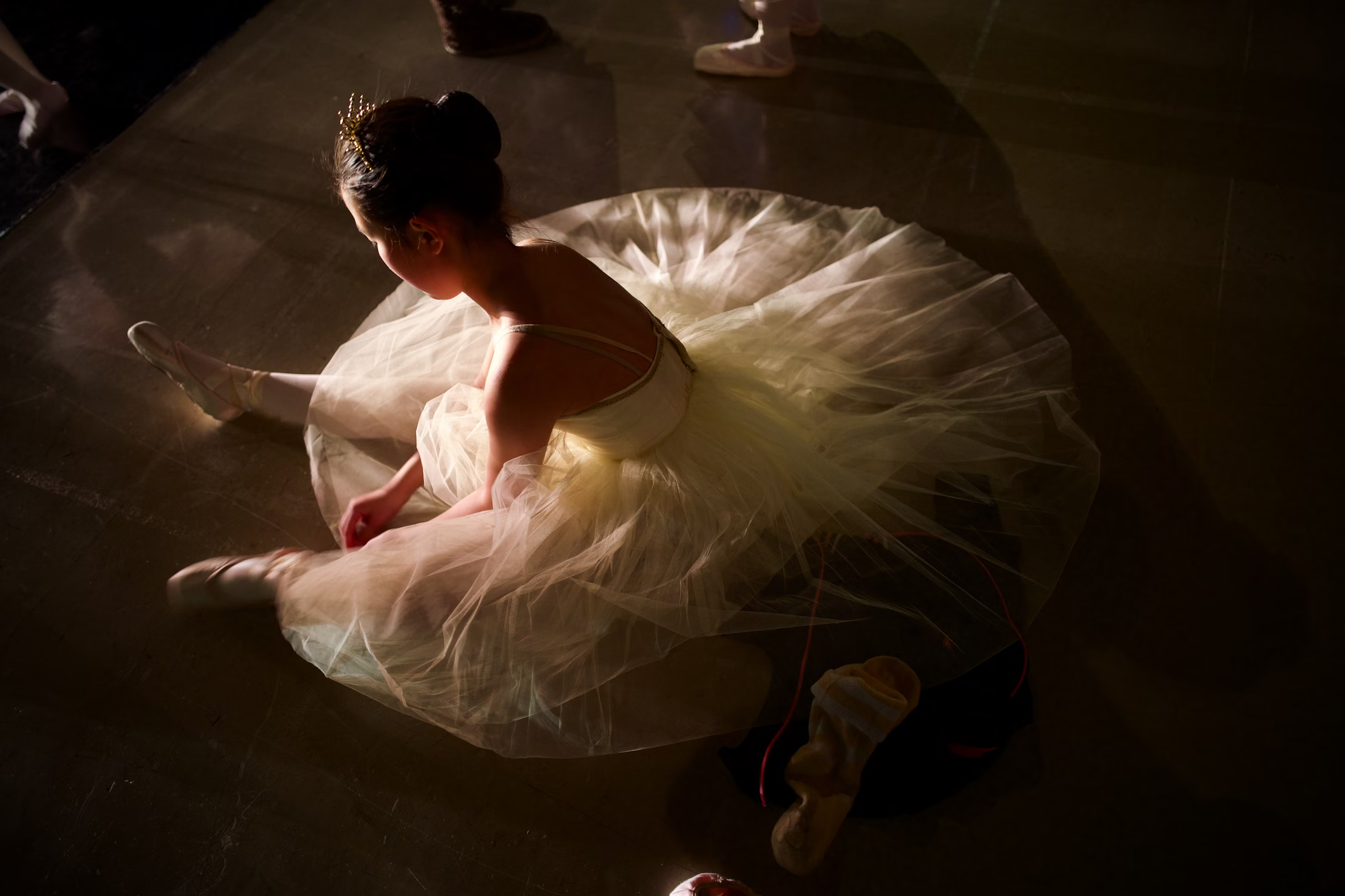 Ballerina sitting down